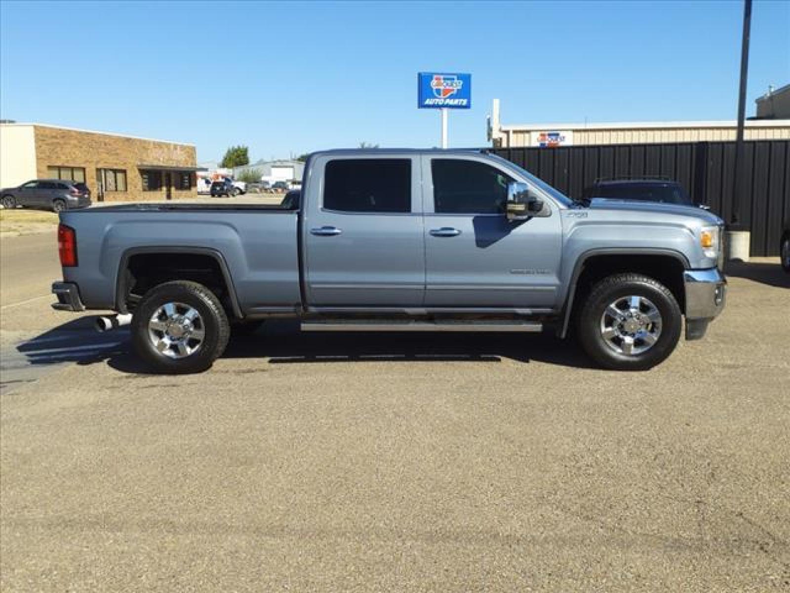 2016 Light Steel Gray Metallic GMC Sierra 2500HD SLT (1GT12TE85GF) with an 6.6L Duramax 6.6L Diesel Turbo Common Rail Direct Injection engine, Allison 1000 6-Speed Shiftable Automatic transmission, located at 1401 N. Hobart, Pampa, TX, 79065, (806) 665-9872, 35.549641, -100.971878 - Photo #2